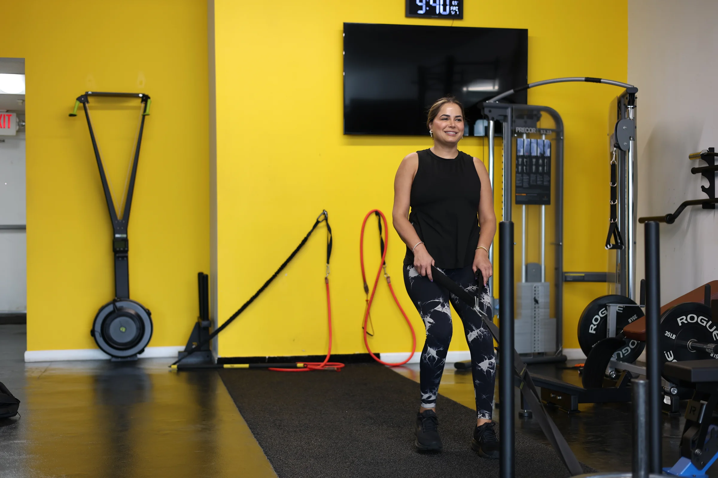 A client smiling on the Pure Function training floor